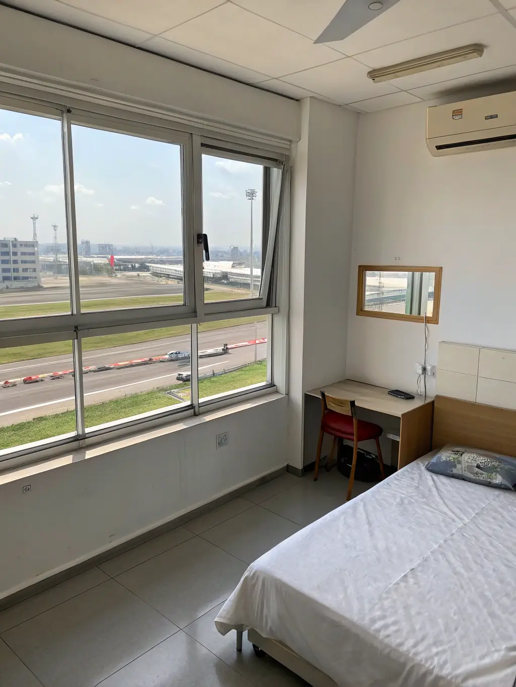 A photograph of comfortable and well-maintained accommodation provided for foreign workers in Hong Kong. The accommodation should appear clean, safe, and welcoming.